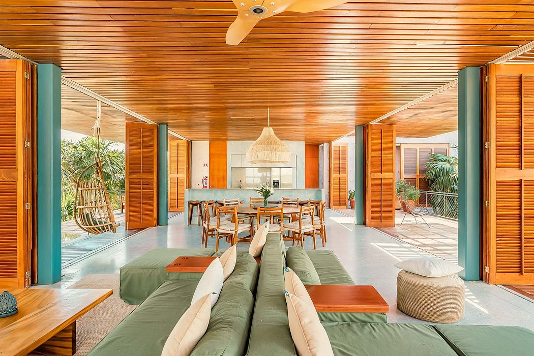 Spacious wooden interior with modern furniture, open layout, and tropical accents.