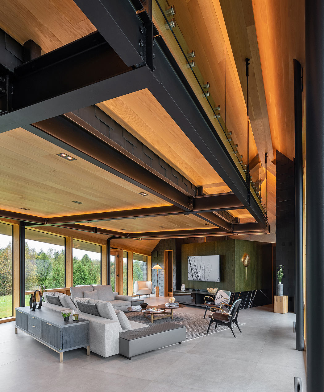Sleek wood beams, modern furniture, and large windows overlooking lush greenery.