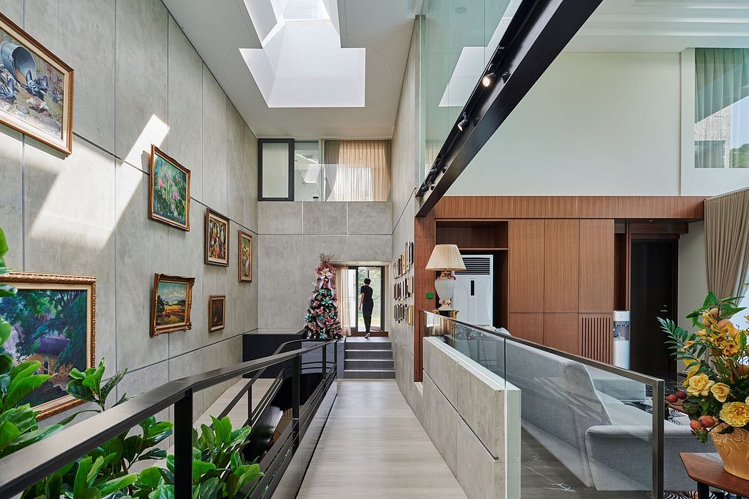 Spacious, modern interior with glass walls, wooden accents, and artwork adorning the walls.