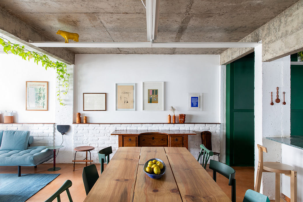 An eclectic mix of vintage furnishings, natural textures, and vibrant colors in a modern, open-concept space.