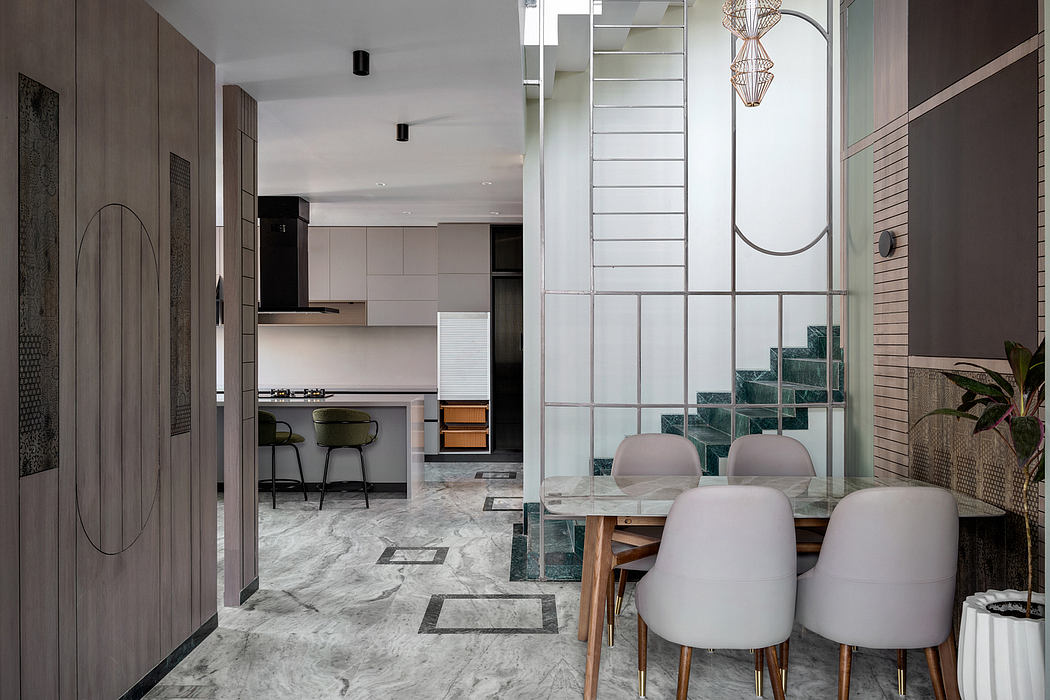Sleek modern kitchen with geometric patterns, textured walls, and marble floors.