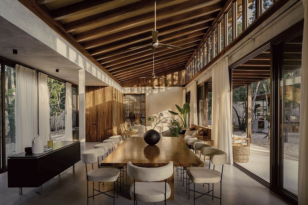 Expansive open-concept dining space with natural wooden beams, large windows, and minimalist decor.