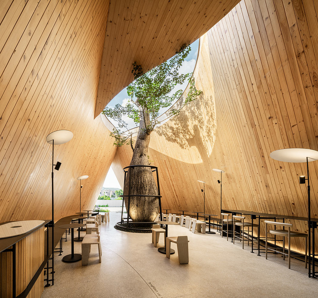 A wooden interior with a large tree growing through the ceiling, surrounded by minimalist furniture.