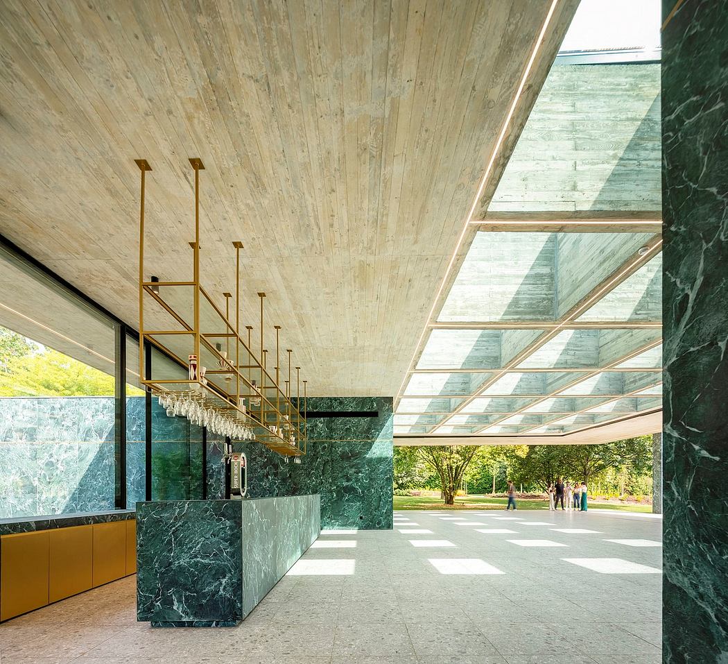 Dramatic wood and glass architecture with striking green marble accents and bold lighting.