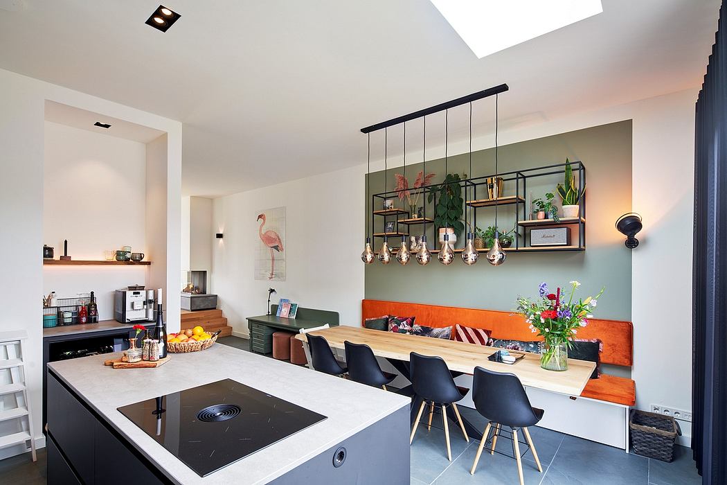 Cozy kitchen-dining space with sleek furniture, shelves, and warm lighting accents.