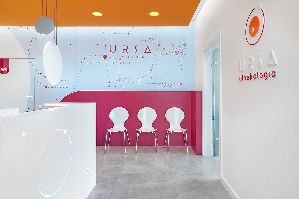 Vibrant medical clinic with stylized star map wall, modern white chairs, and sleek concrete floors.