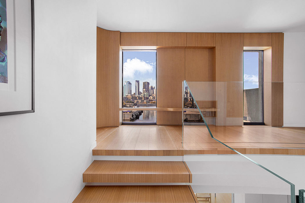 Sleek, modern interior with wooden paneling and expansive city views through large windows.