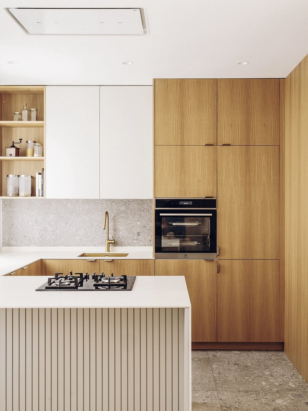 A modern kitchen with sleek wooden cabinetry, a gas cooktop, and a built-in oven.