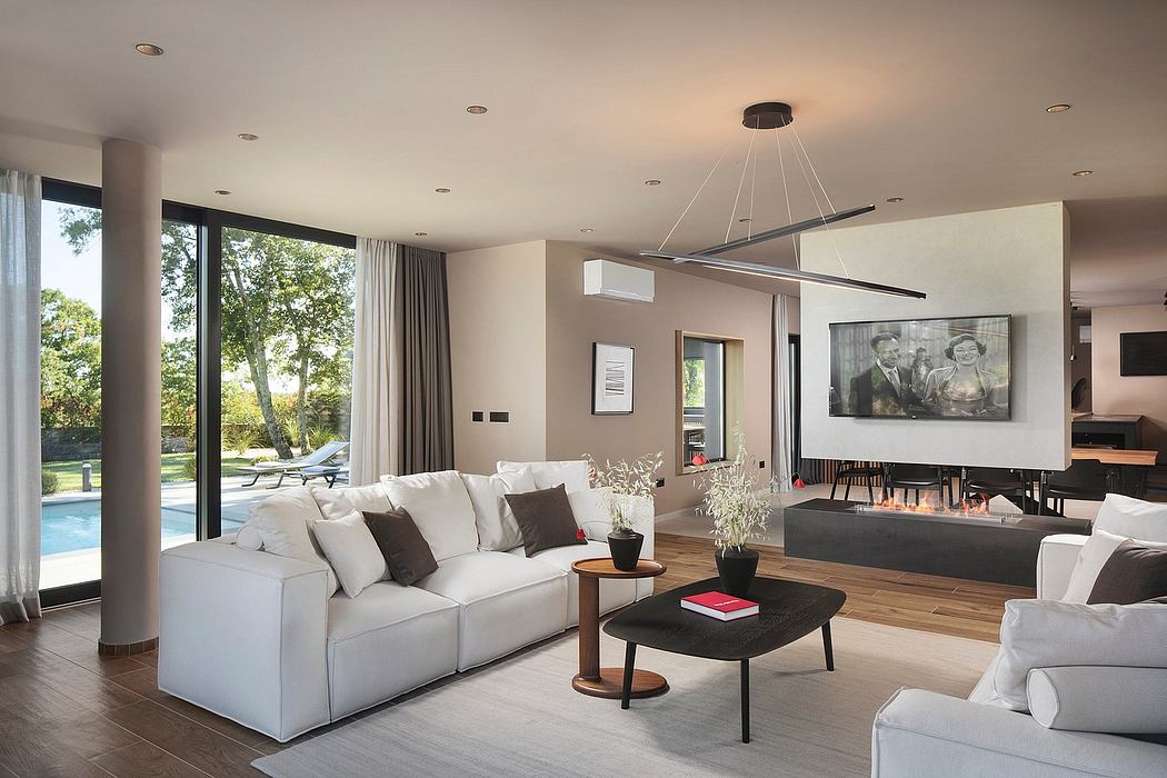 Luxurious open-plan living space with floor-to-ceiling windows, contemporary furniture.