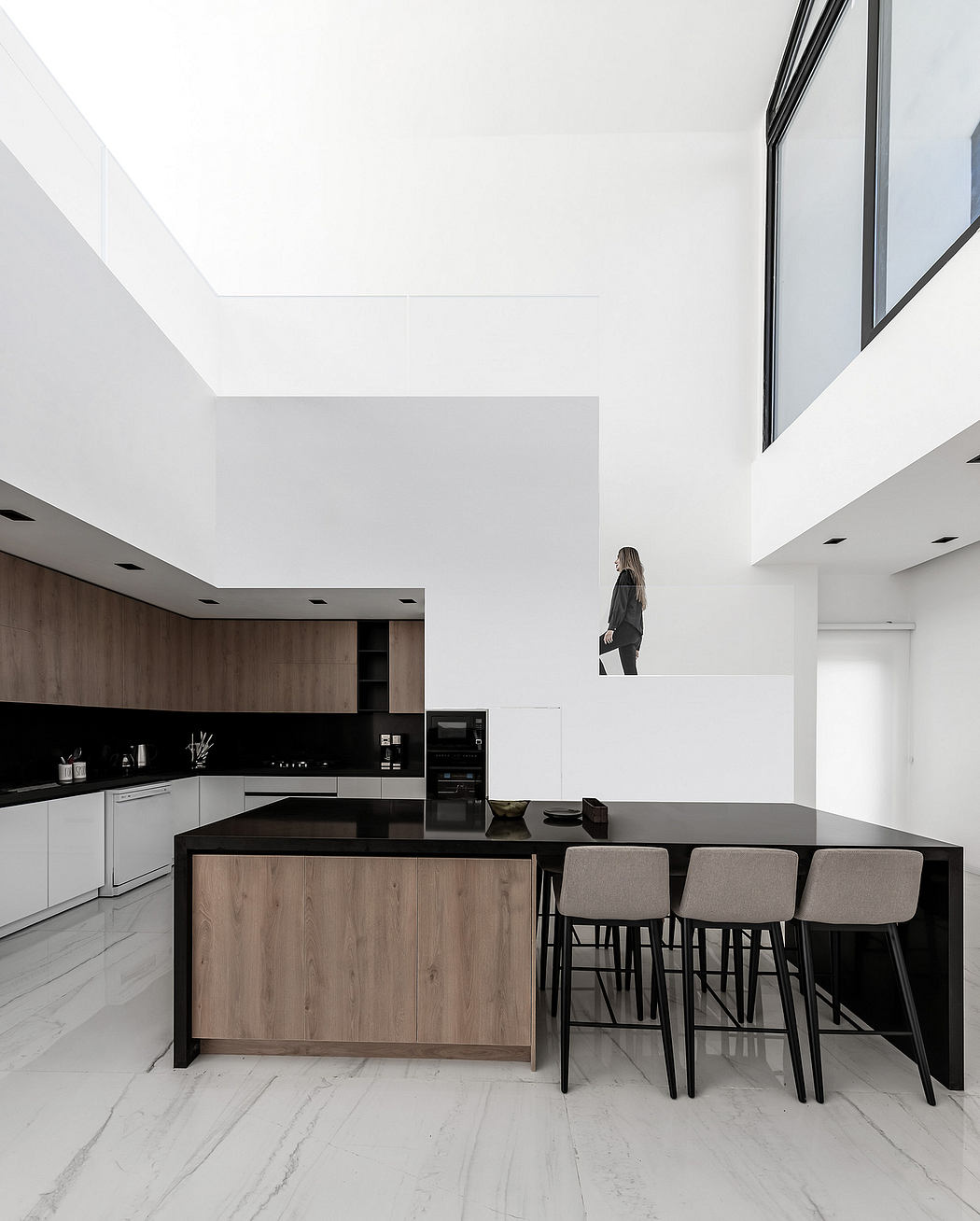 Minimalist kitchen with dark wood cabinetry, marble floors, and recessed lighting.