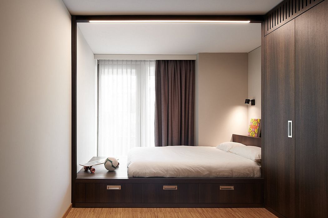 Minimalist bedroom design with built-in storage, recessed lighting, and neutral color scheme.