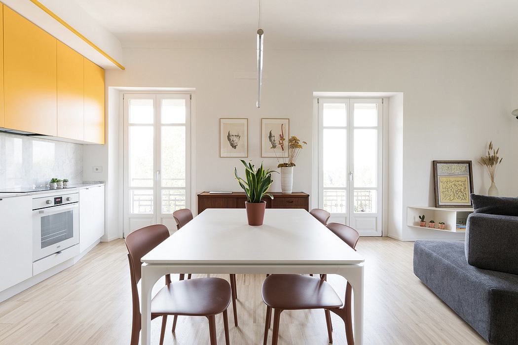 Bright, open-concept living space with minimalist furniture and tasteful decor.