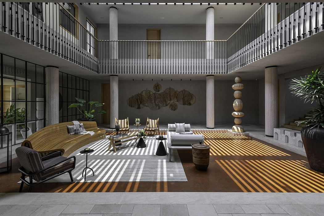 Spacious, modern lobby featuring intricate architectural elements and stylish furniture.