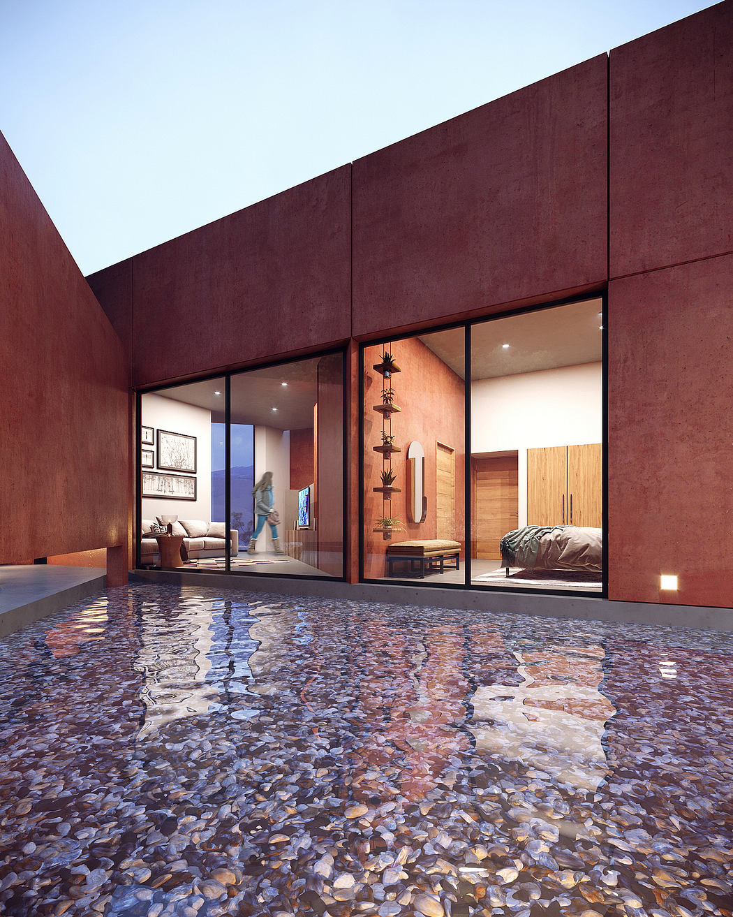 Stunning modern interior with a tranquil pebble-filled water feature and warm wood accents.