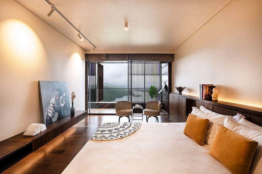 A modern, minimalist living room with large windows offering a scenic view.