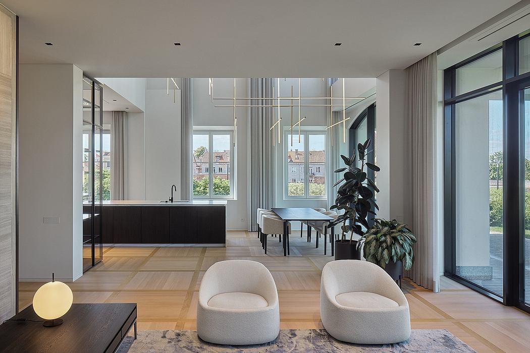 Spacious modern interior featuring sleek kitchen, glass walls, and stylish furnishings.