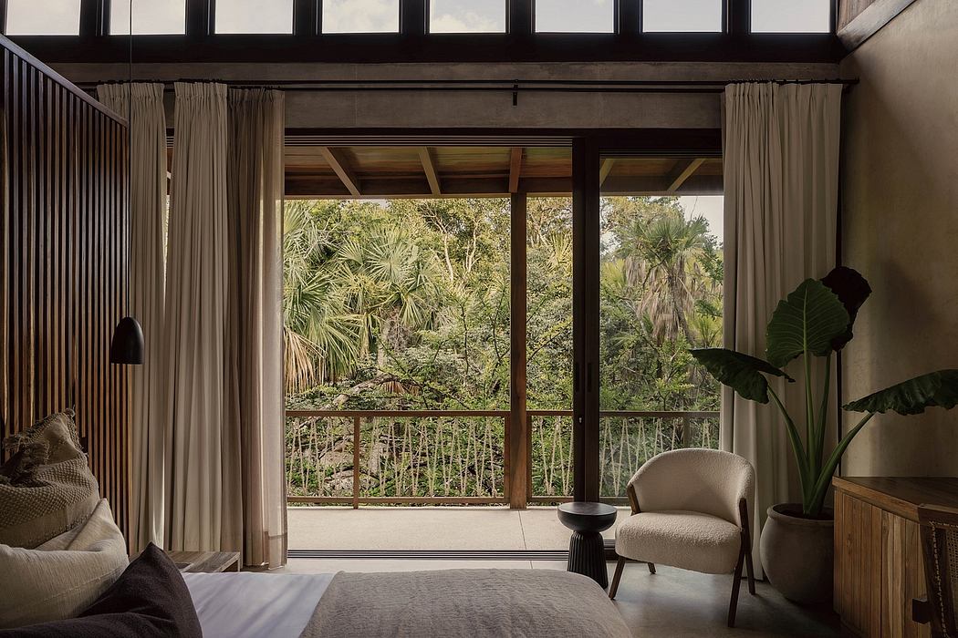 Spacious room with rustic wooden beams, large windows overlooking lush greenery, and modern furnishings.