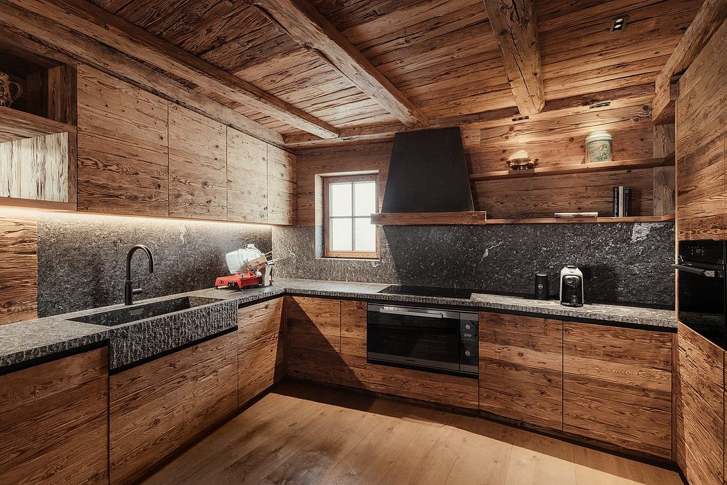 A rustic, wooden kitchen with a sleek, black granite countertop and built-in appliances.