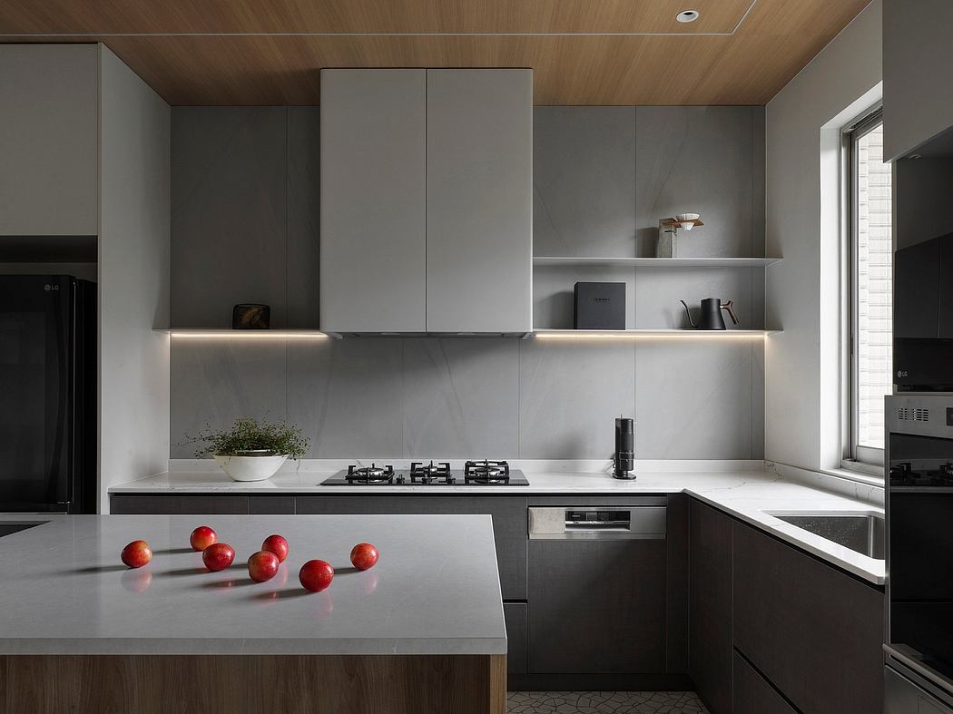 Contemporary kitchen with sleek gray cabinetry, recessed lighting, and integrated appliances.