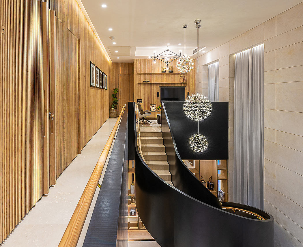 Opulent contemporary home interior with wooden paneling, chandeliers, and modern staircase.