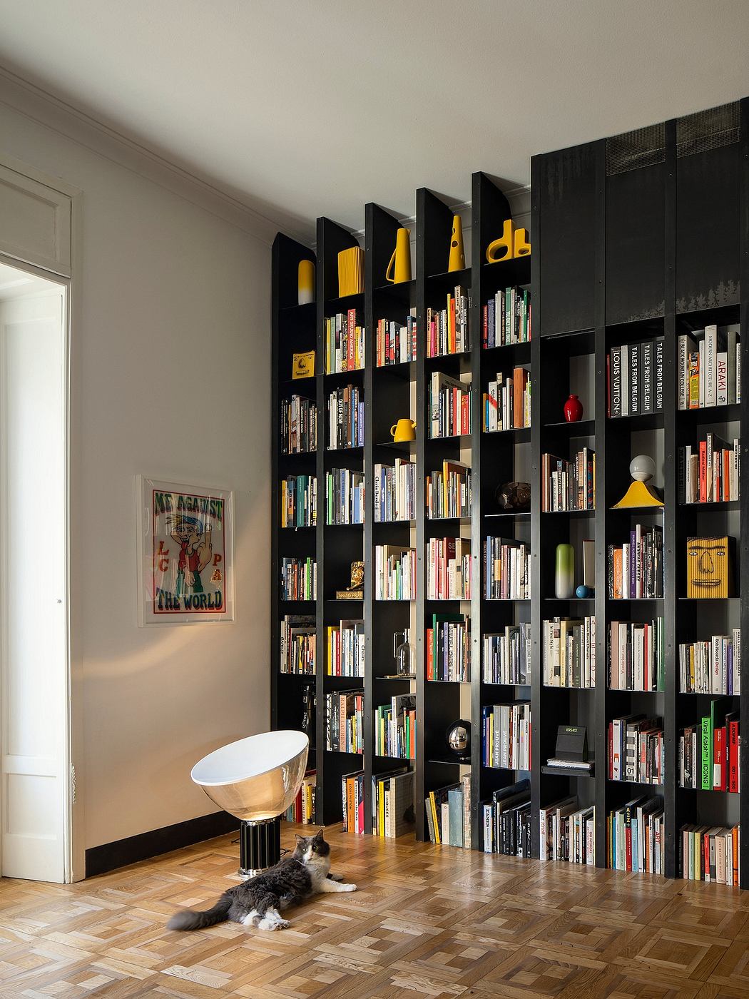 Expansive built-in bookshelves with colorful accents, creating a cozy, personalized space.