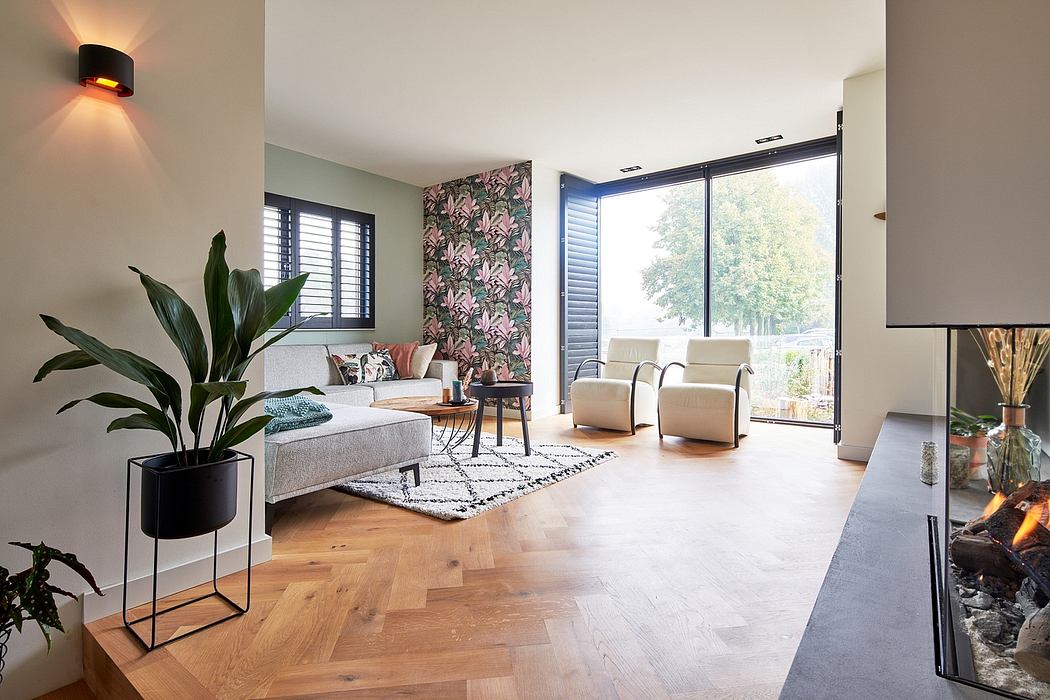 A modern and stylish living room with large windows, patterned accent wall, and wood flooring.