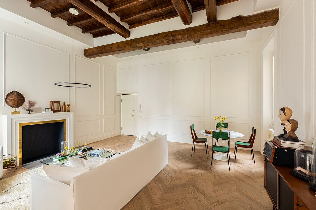 Warm, rustic space with exposed wood beams, modern furnishings, and decorative accents.