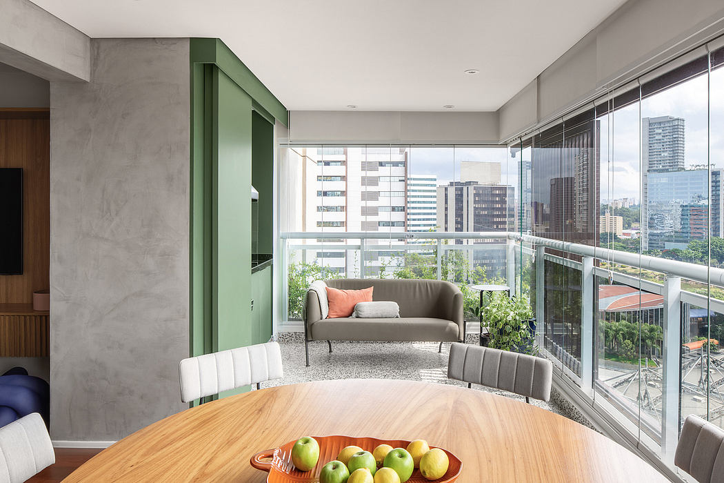 Modern, minimalist apartment with floor-to-ceiling windows, green accents, and city skyline view.