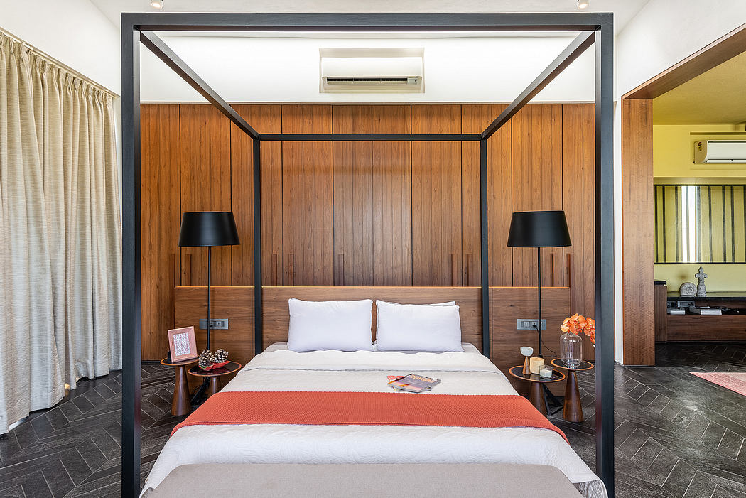 Elegant modern bedroom with wooden walls, canopy bed, and sleek lamps. Sophisticated design.