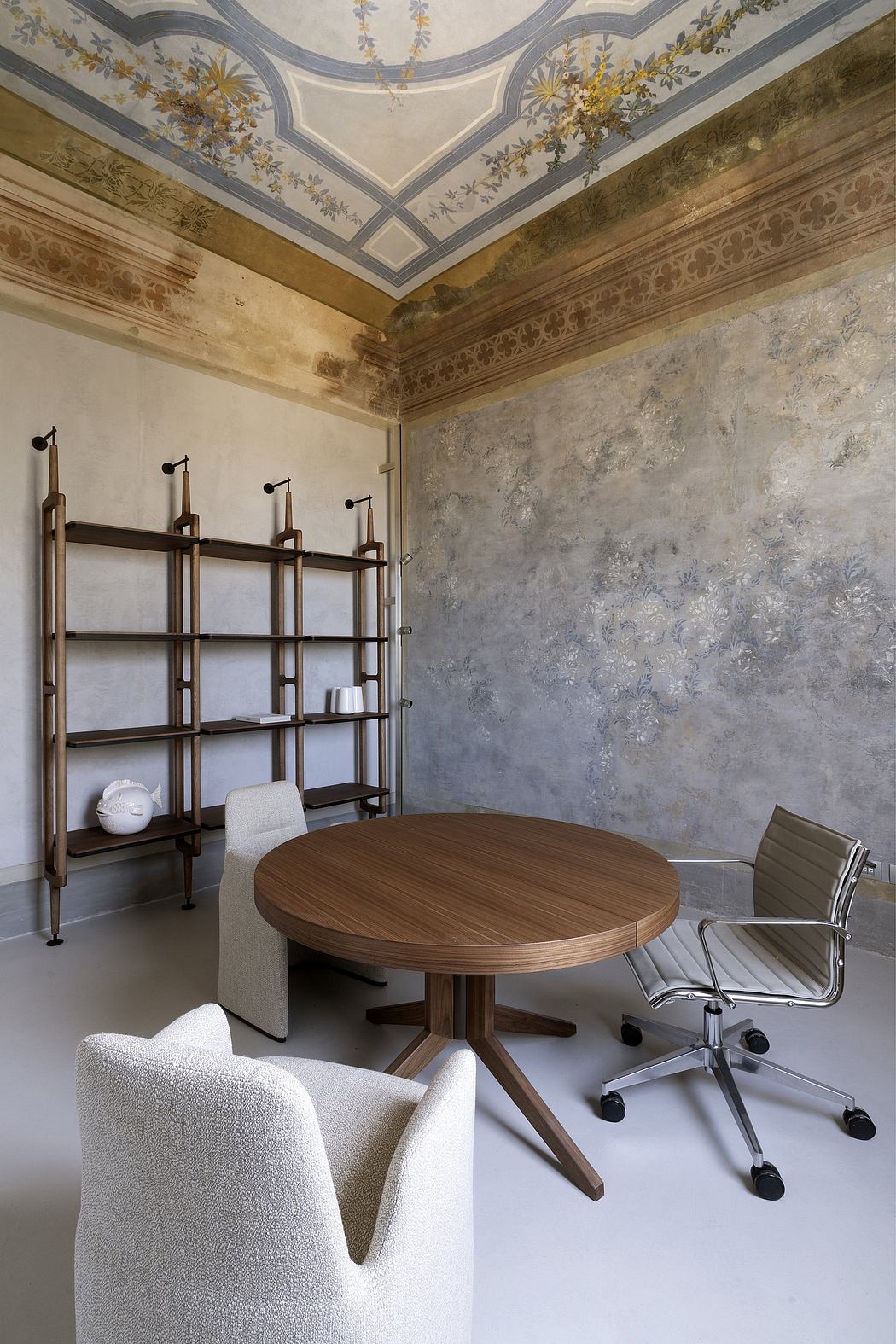 A stylish office space with ornate ceiling, wooden furniture, and minimalist decor.