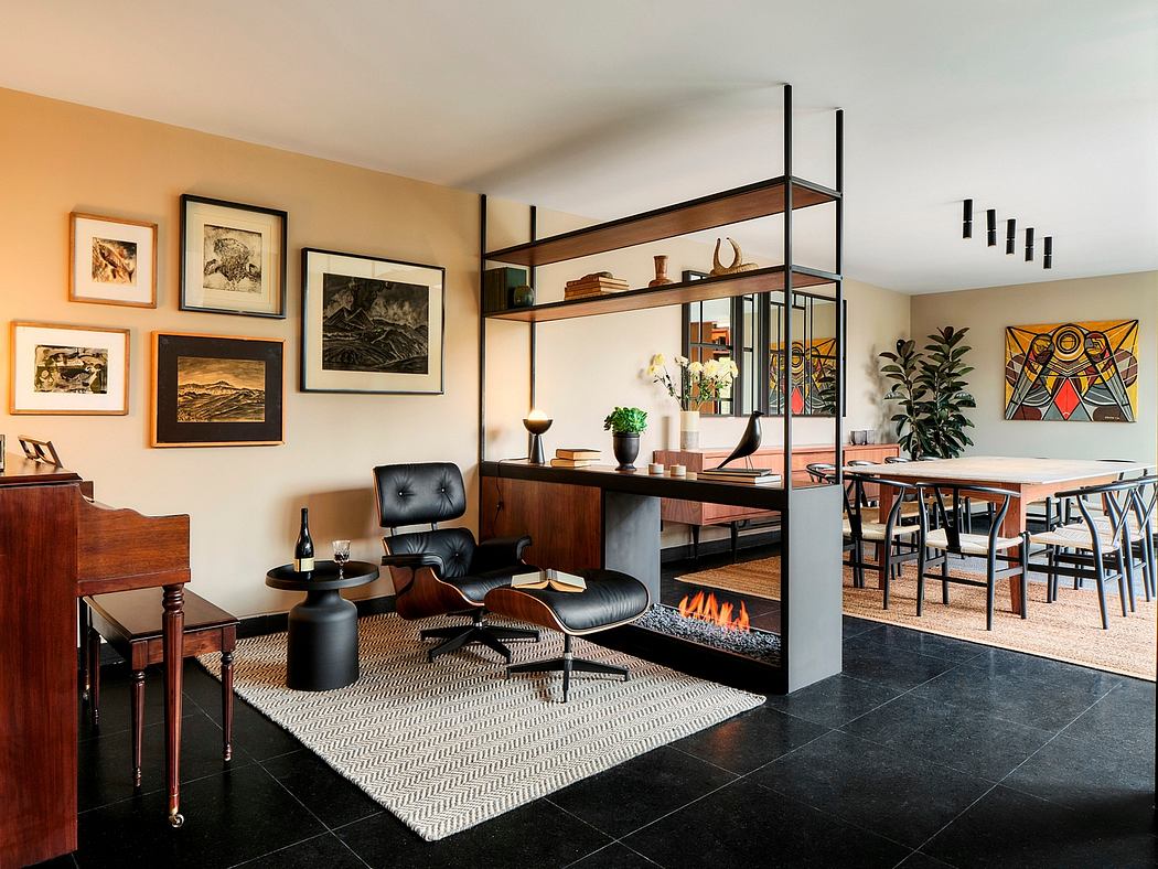 A mid-century modern living space with sleek furniture, art, and a central fireplace.