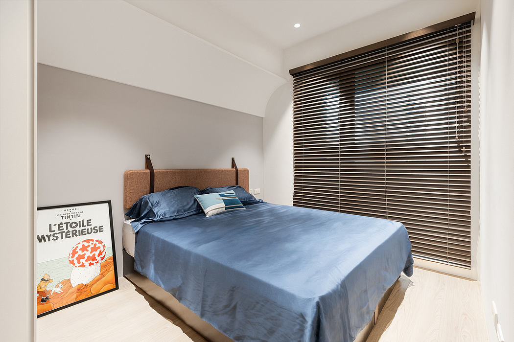 Minimalist bedroom design with wooden blinds, neutral walls, and modern headboard.