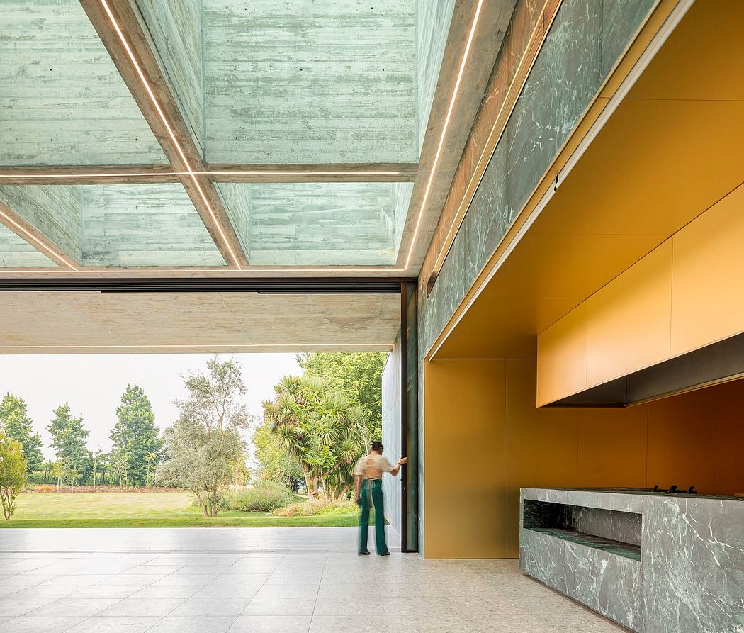 Expansive glass exterior with wooden beams and vibrant yellow walls creating an open, modern space.