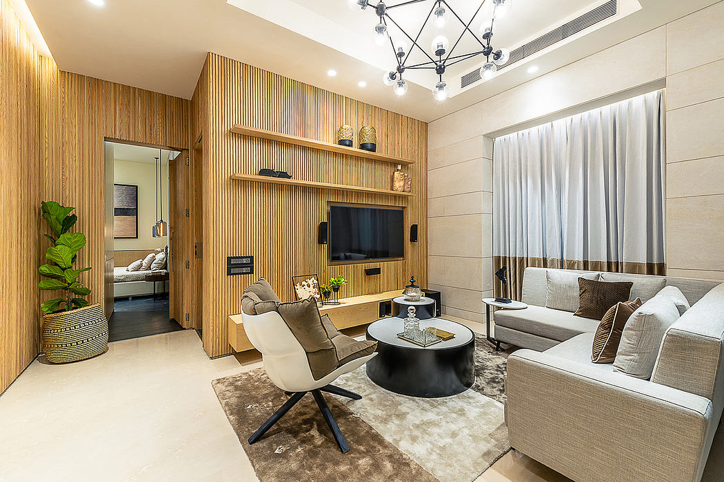 Elegant modern living room with wood-paneled wall, plush seating, and pendant lighting.