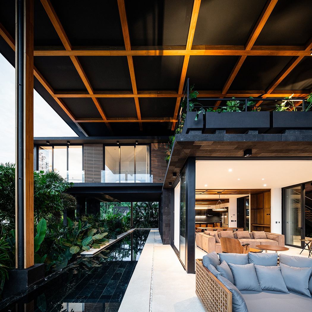 Striking wood and glass structure, with lush indoor greenery and modern furniture.