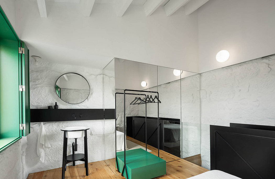 Modern minimalist bedroom design with marble walls, black furniture, and green accents.