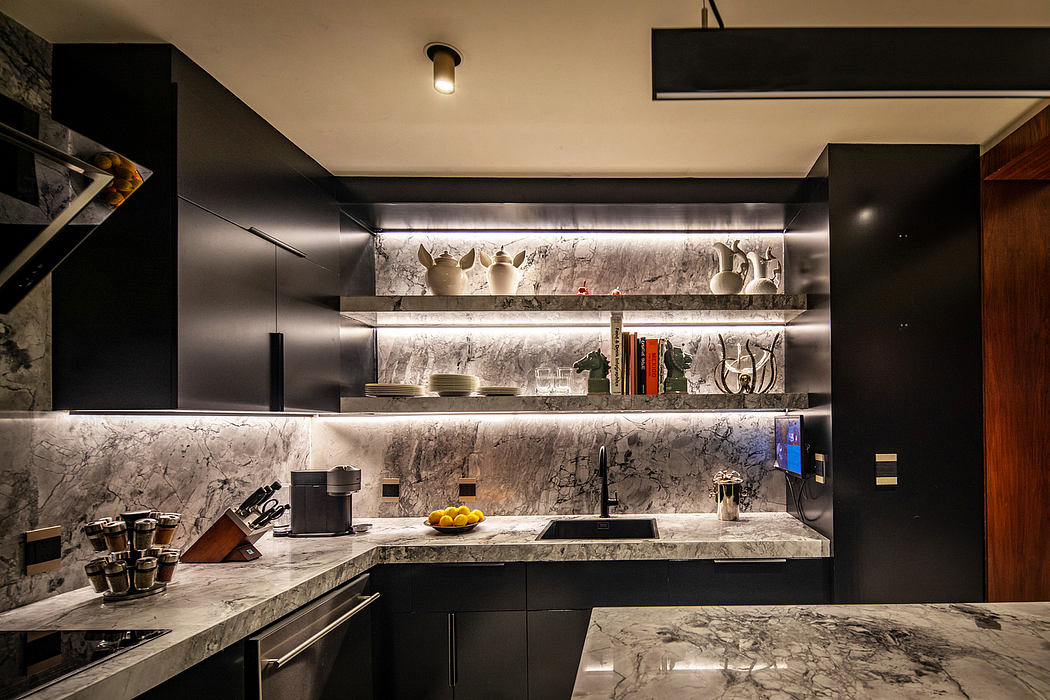 Sleek, modern kitchen with muted gray marble countertops, shelving, and appliances.
