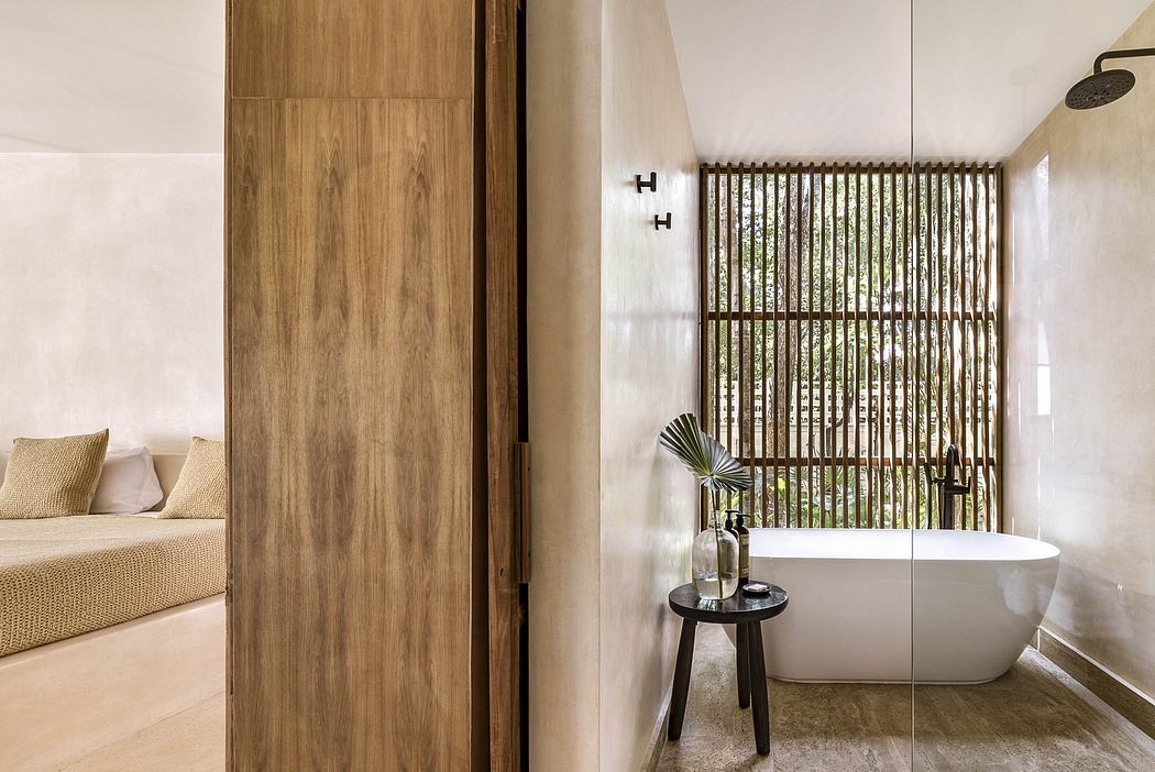 Sleek, modern bathroom with wooden accents, freestanding tub, and bamboo screen divider.