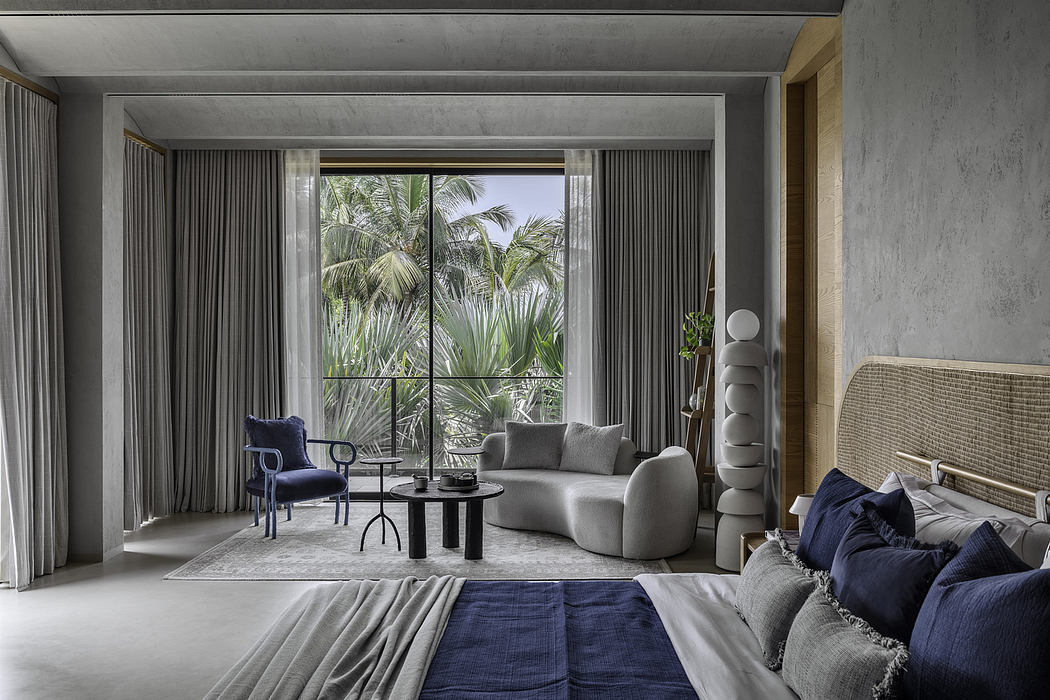 Spacious contemporary living room with floor-to-ceiling windows, plush seating, and tropical views.