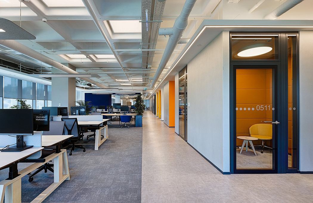 Modern office interior with clean lines, bright colors, and open workspaces.