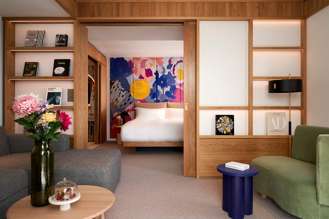 Warm, modern bedroom design with wood paneling, colorful artwork, and comfortable furnishings.