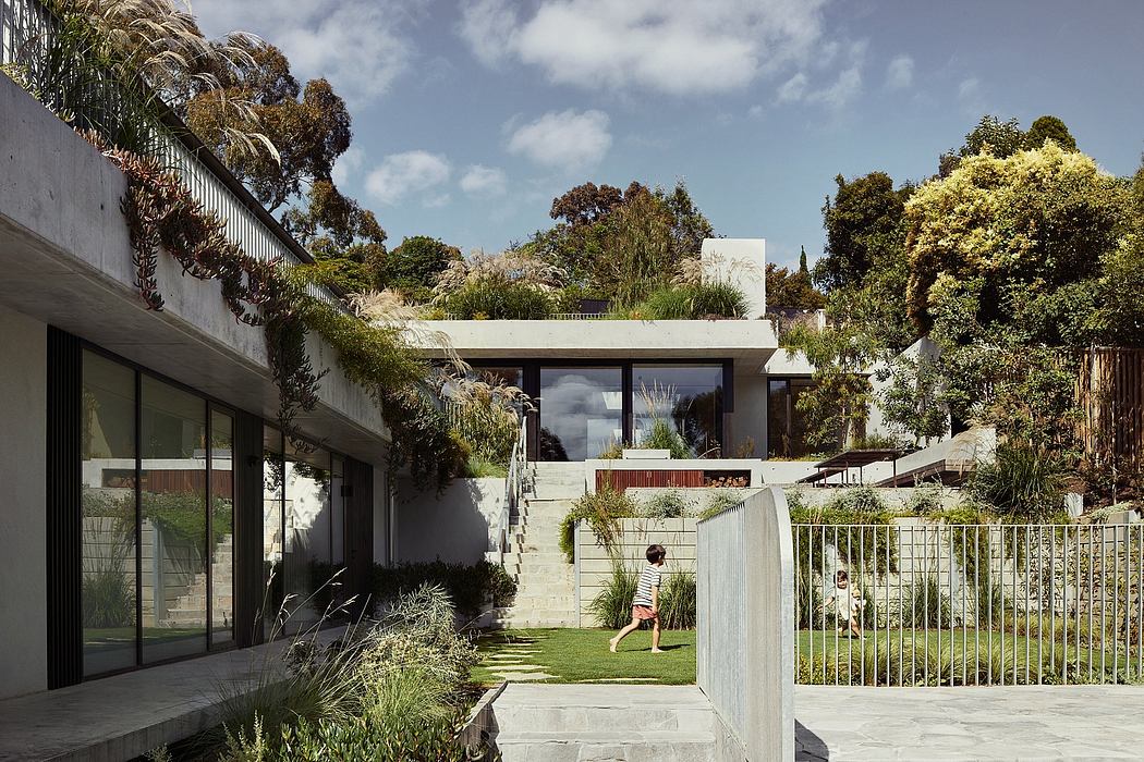 A modern, tropical-inspired home with lush landscaping, clean lines, and large windows.