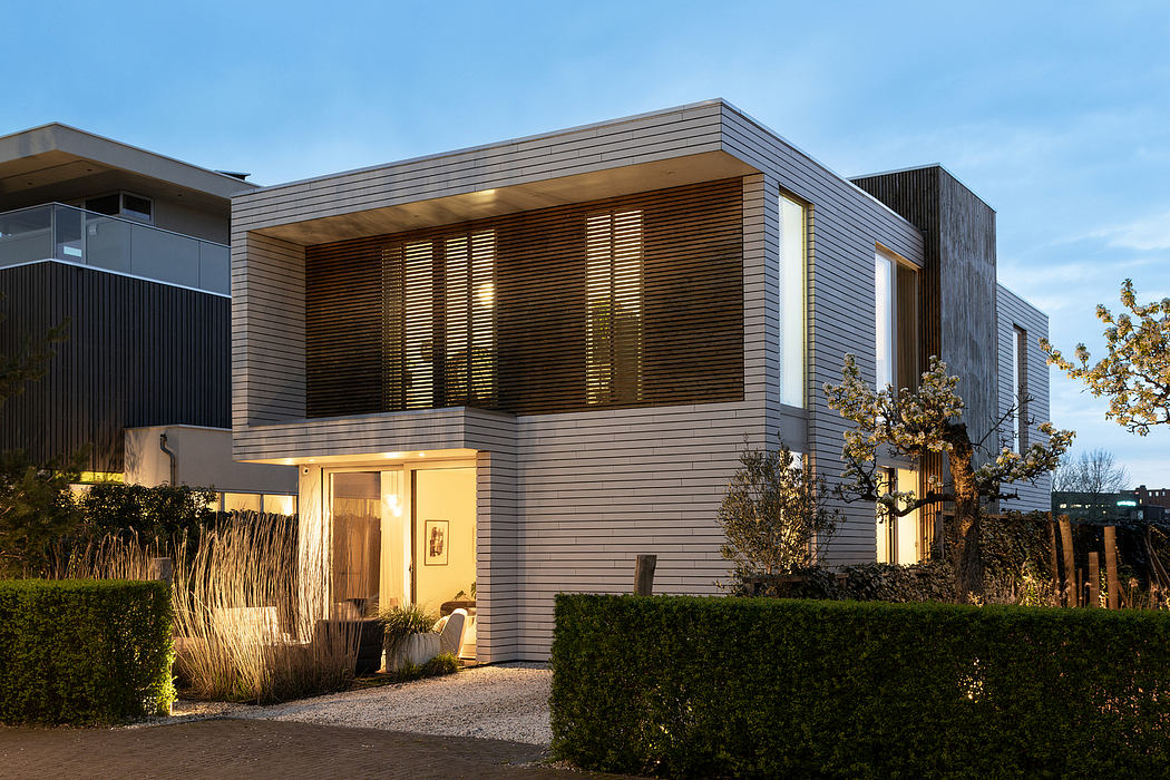 Sleek, modern wooden facade with sliding shutters and elegant landscaping outside.