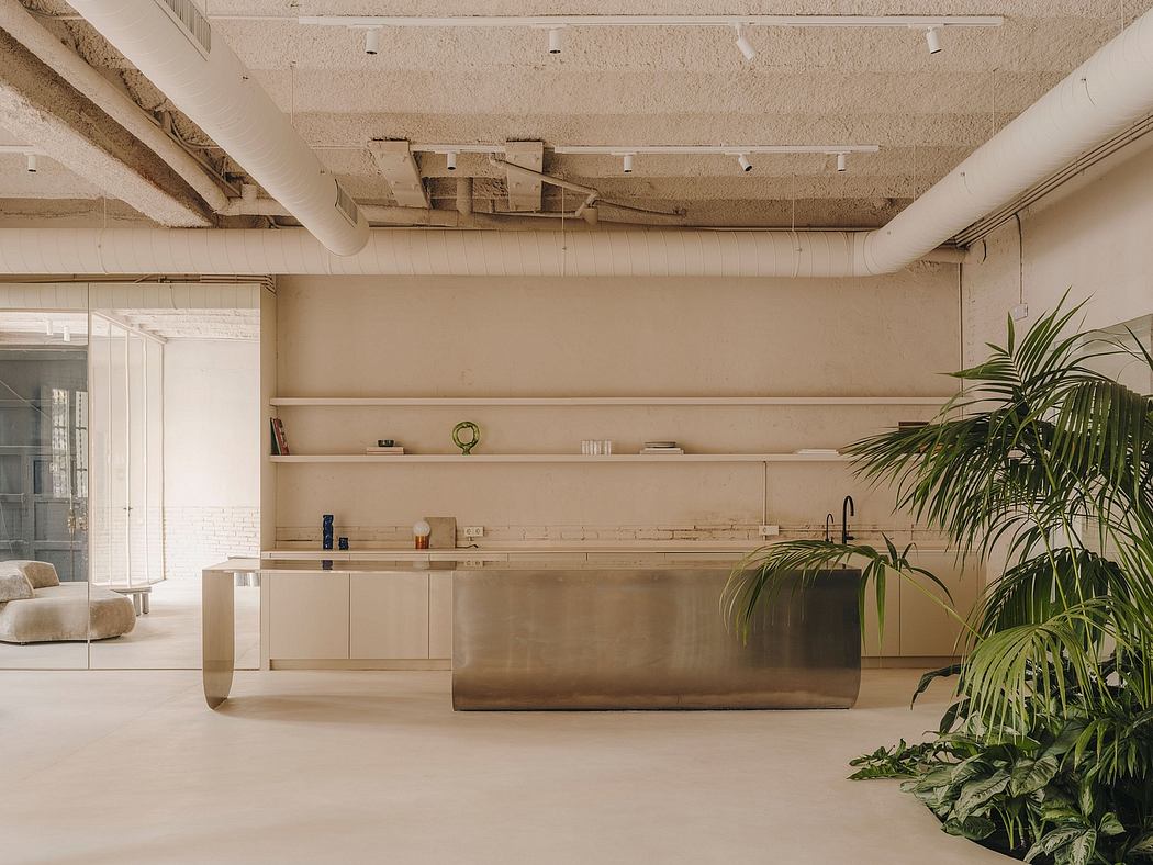 Minimalist industrial-style loft interior with open shelves, potted plants, and a steel kitchen counter.
