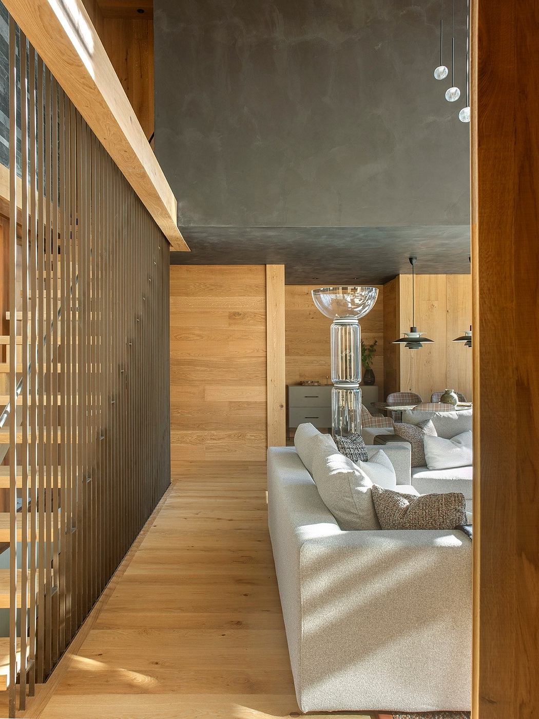 Modern, rustic interior with wooden accents, sleek lighting, and comfortable seating.