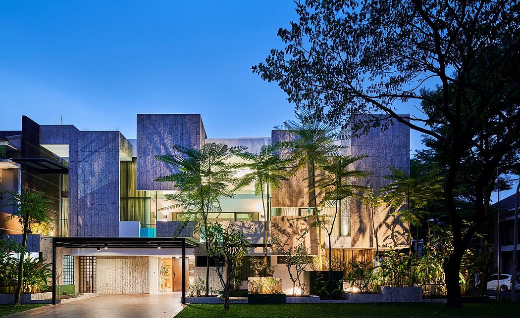 Striking modern architecture with palm trees and lush vegetation in the foreground.