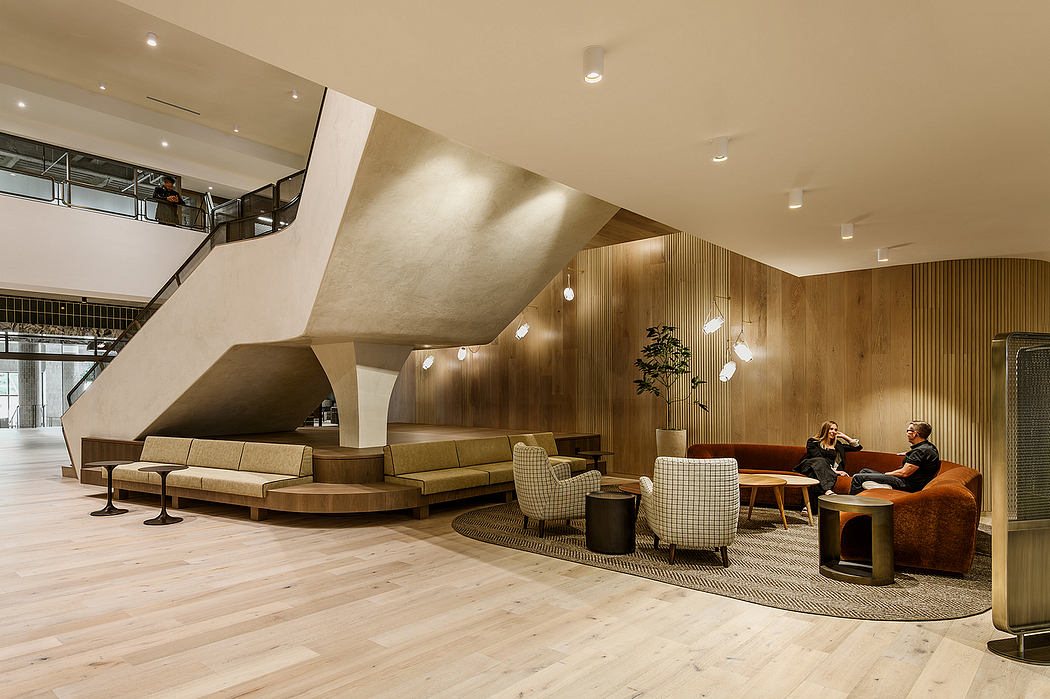 Elegant modern lounge with wood paneling, plush seating, and recessed lighting.