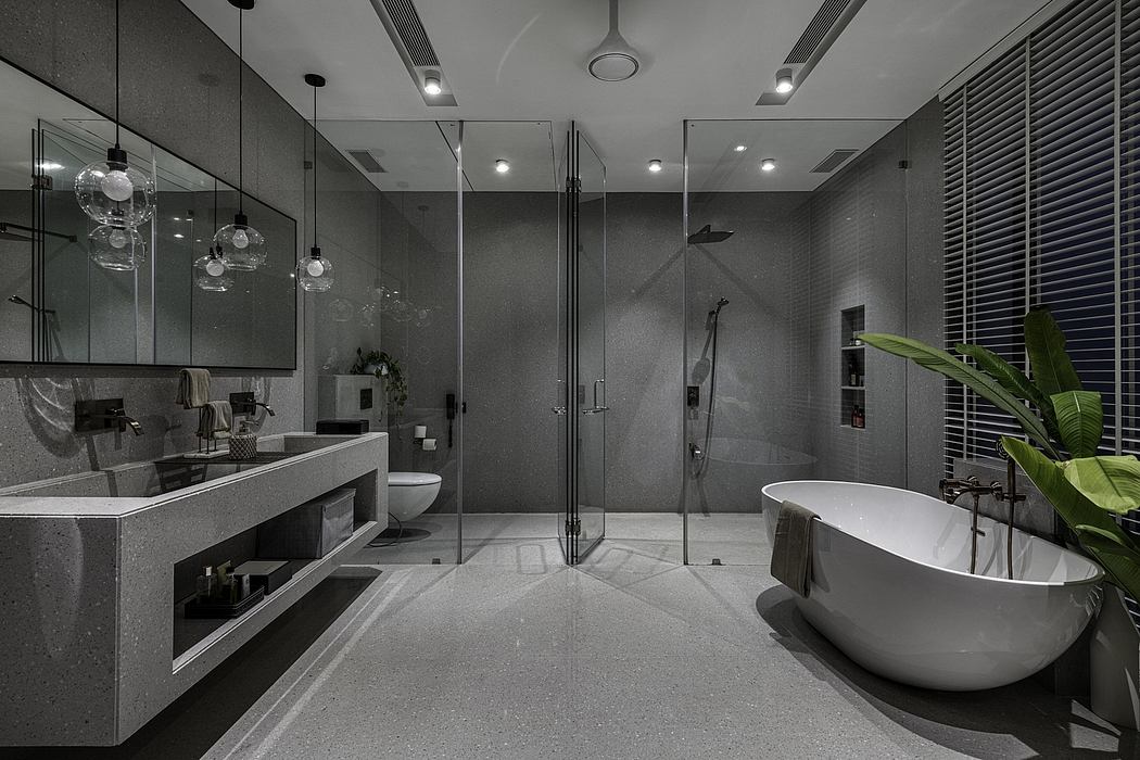 Sleek modern bathroom with glass enclosed shower, freestanding tub, and floating vanity.