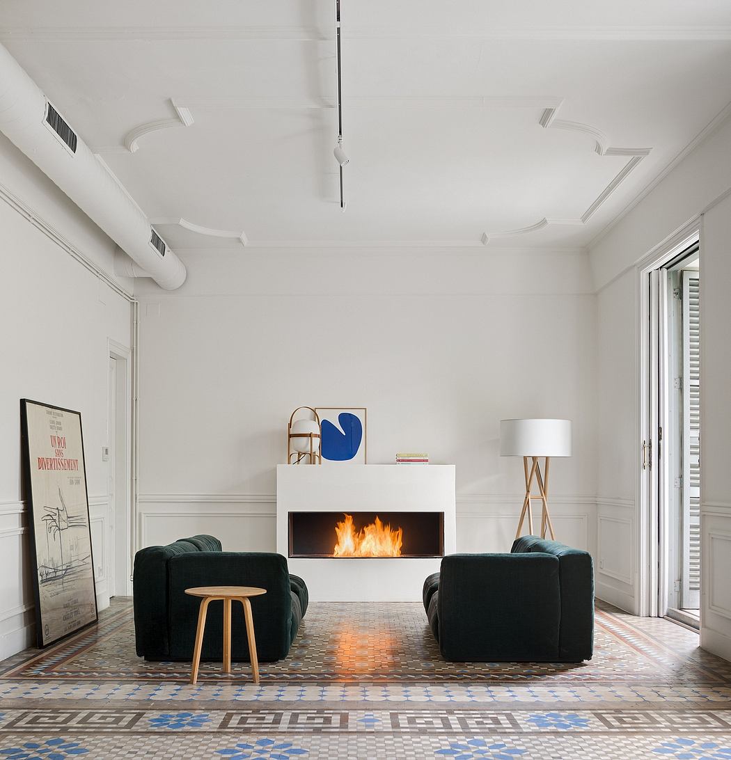 A modern, minimalist living room with a fireplace and patterned tile floor, accented by contemporary furnishings.