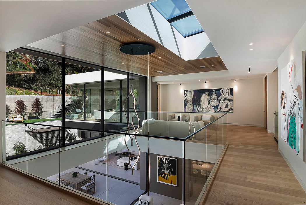 Expansive glass walls and ceilings, modern wood paneling, and an artistic interior.